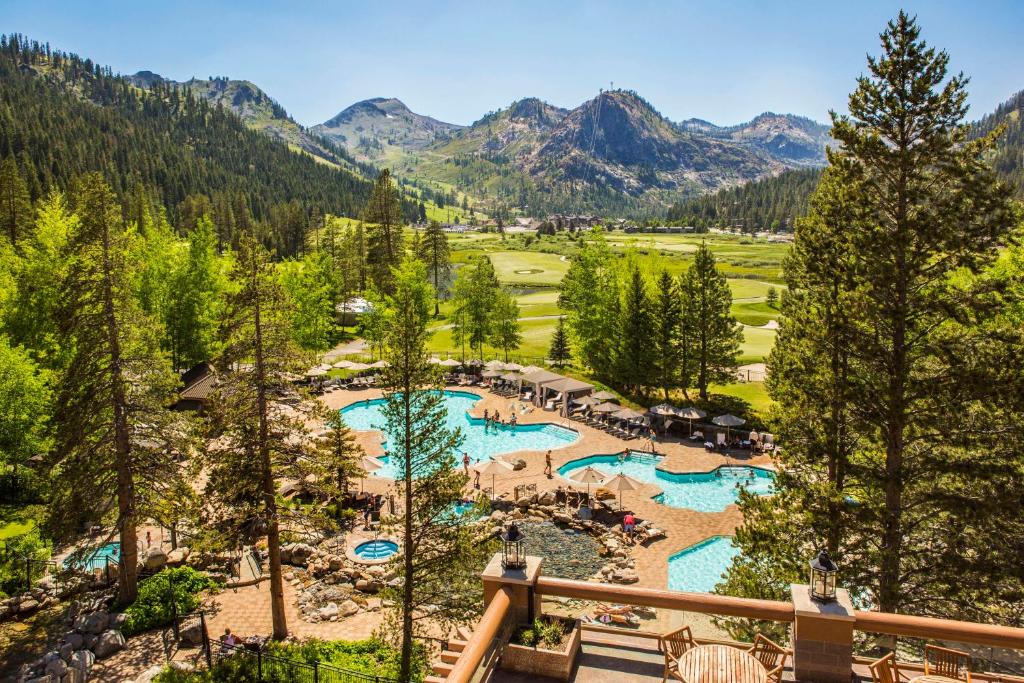 an aerial view of a resort with two swimming pools at The Everline Resort and Spa, a Destination by Hyatt Hotel in Olympic Valley