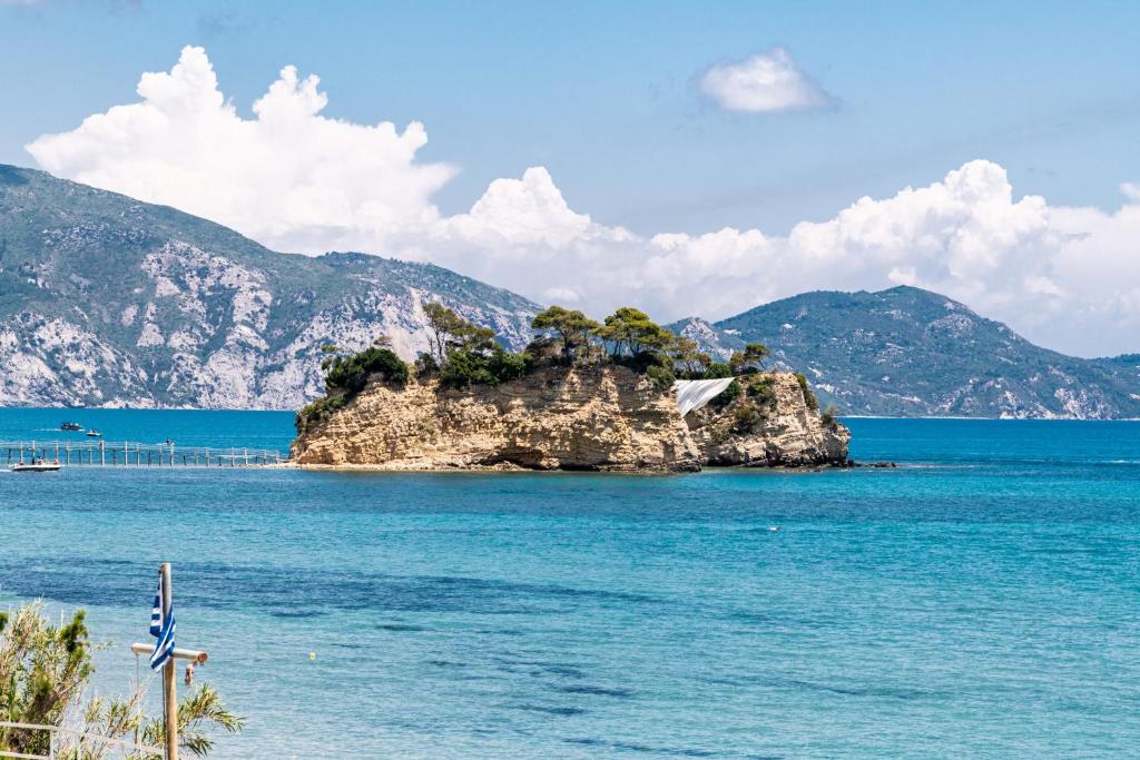 a small island in the middle of the water at Blue Horizon Studios in Laganas