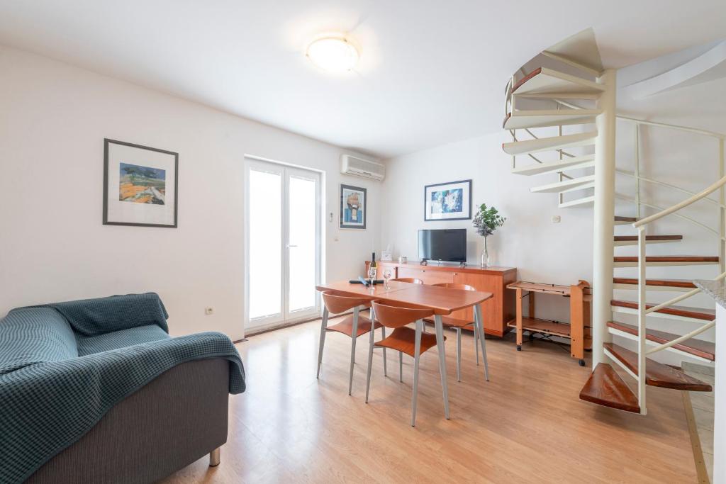 Televízia a/alebo spoločenská miestnosť v ubytovaní Apartment Soulmate