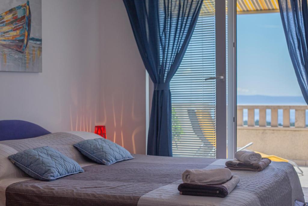 Postel nebo postele na pokoji v ubytování Apartments Branka