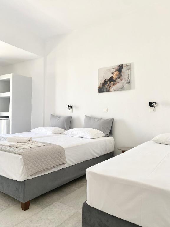 Postel nebo postele na pokoji v ubytování Fikas Hotel
