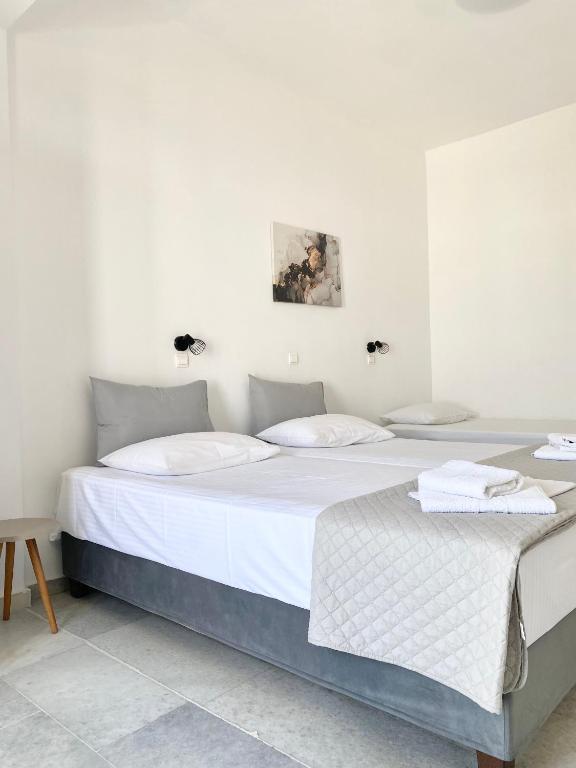 Postel nebo postele na pokoji v ubytování Fikas Hotel