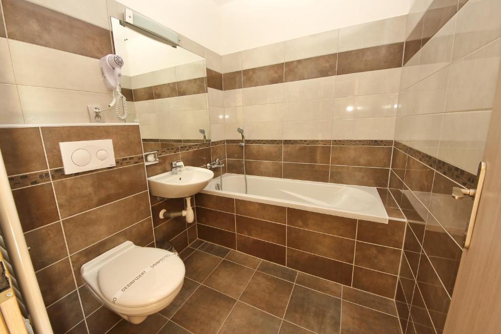 Koupelna v ubytování Hotel U Tří hrušek suites & apartments