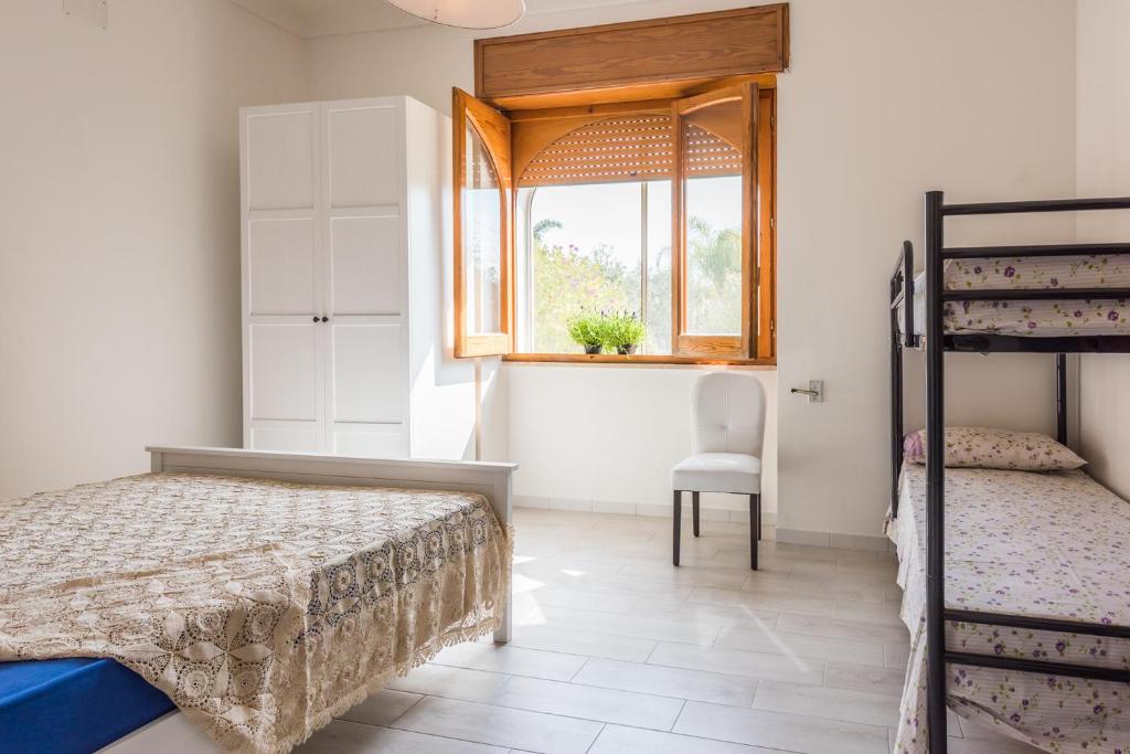 A bed or beds in a room at Mare Relax