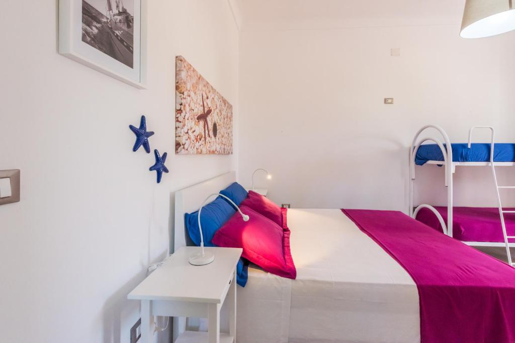 A bed or beds in a room at Mare Relax