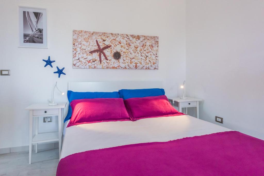 A bed or beds in a room at Mare Relax