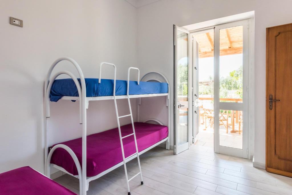 A bed or beds in a room at Mare Relax