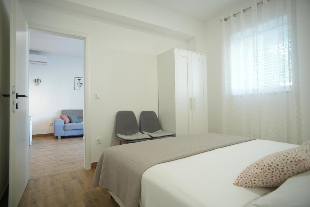 Postel nebo postele na pokoji v ubytování Apartments Petrich