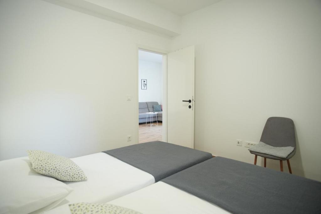 Postel nebo postele na pokoji v ubytování Apartments Petrich