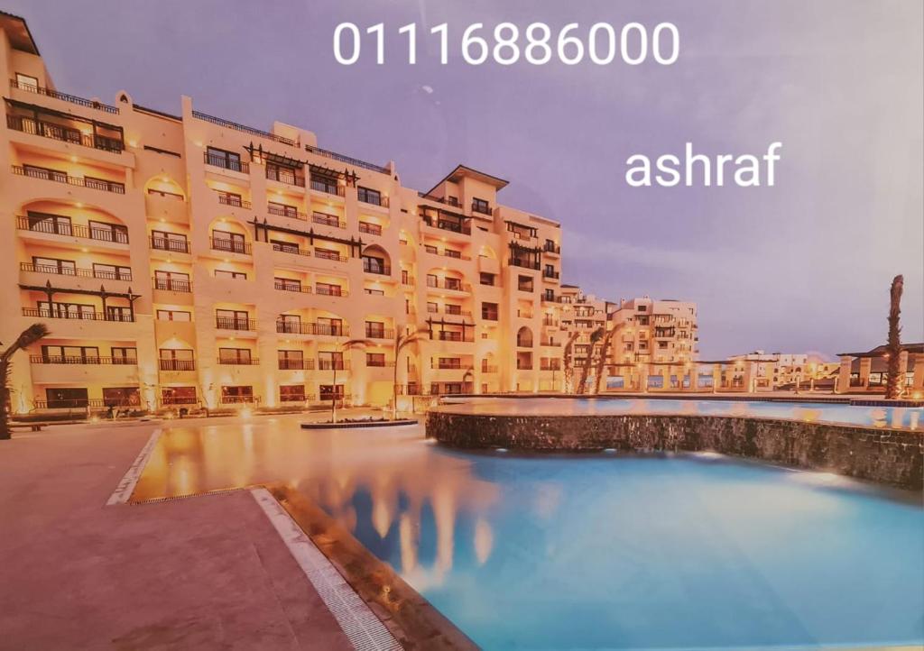 a large building with a river in front of it at Aldau Heights in Hurghada