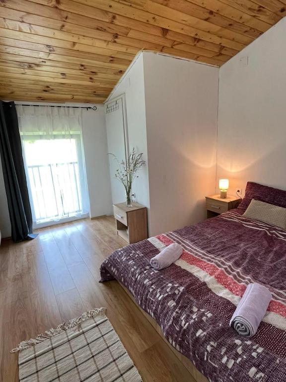 Postel nebo postele na pokoji v ubytování Rooms Ljubenko