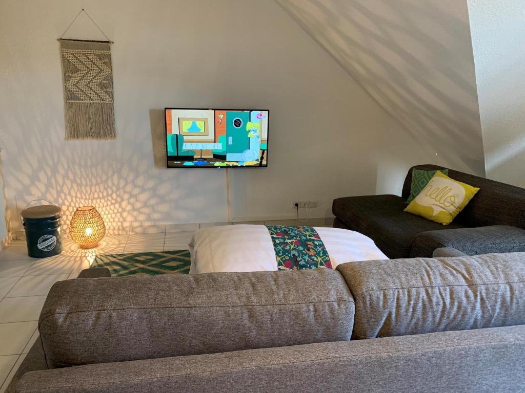 TV a/nebo společenská místnost v ubytování Hôtel Heod - Binic - Saint-Quay-Portrieux
