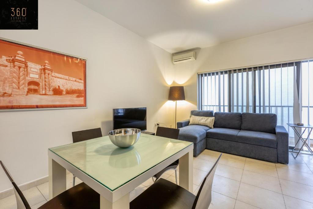 A seating area at Modern & private 1BR APT in the Heart of Paceville by 360 Estates