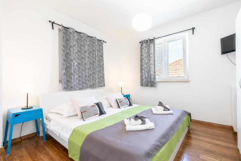 Postel nebo postele na pokoji v ubytování Apartments Karisima