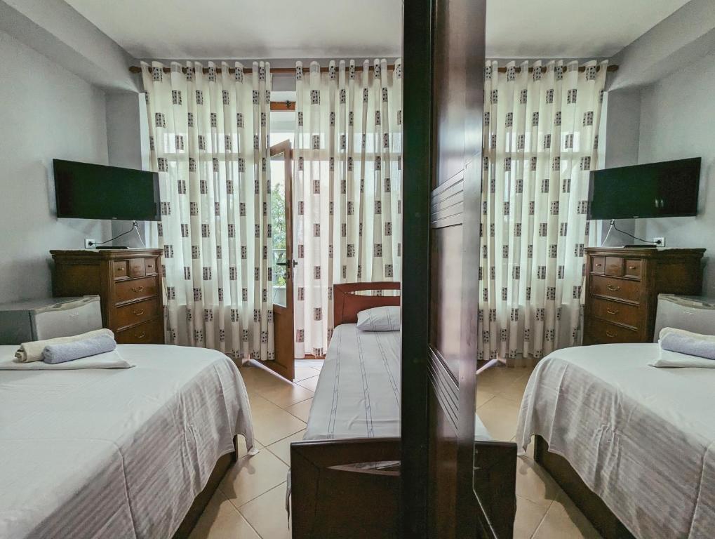 Postel nebo postele na pokoji v ubytování Vila Vadeha