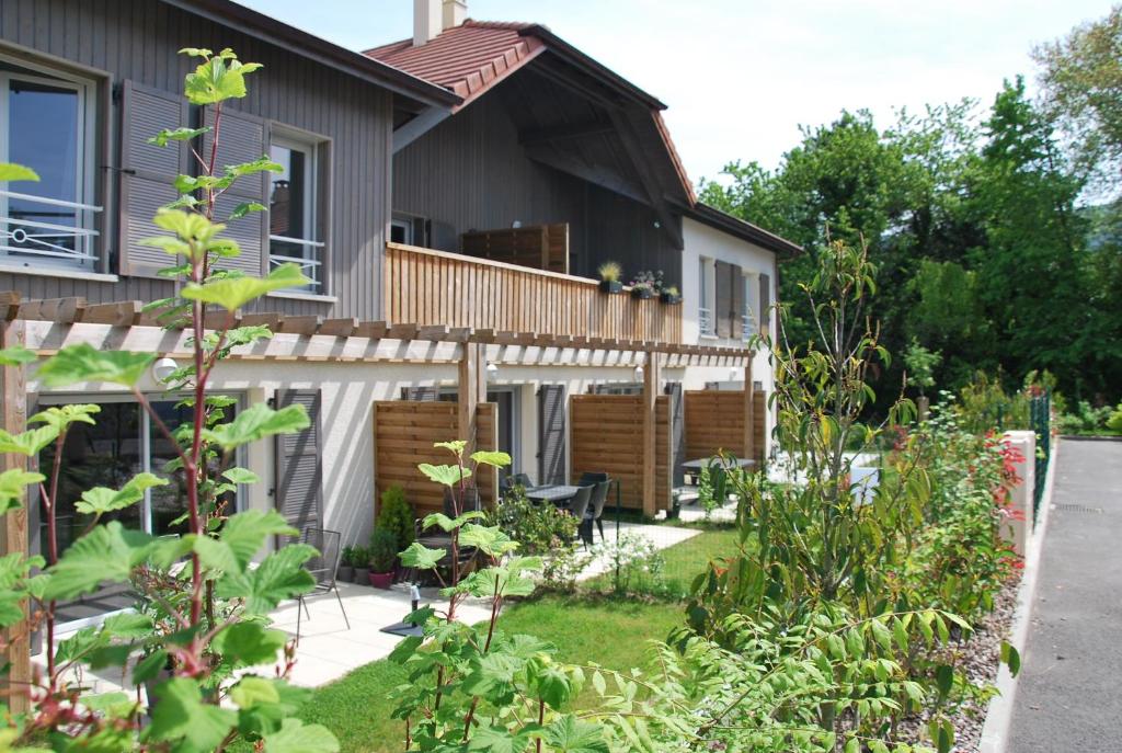 a garden in front of a house at Villa Catalina in Annecy