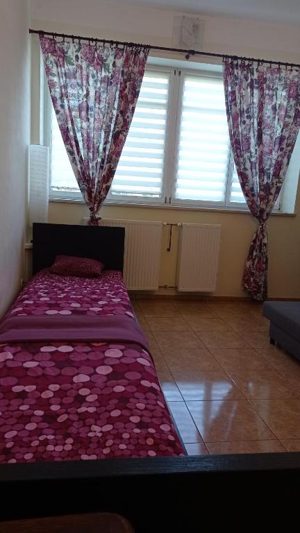 Postel nebo postele na pokoji v ubytování Dolina Witówki