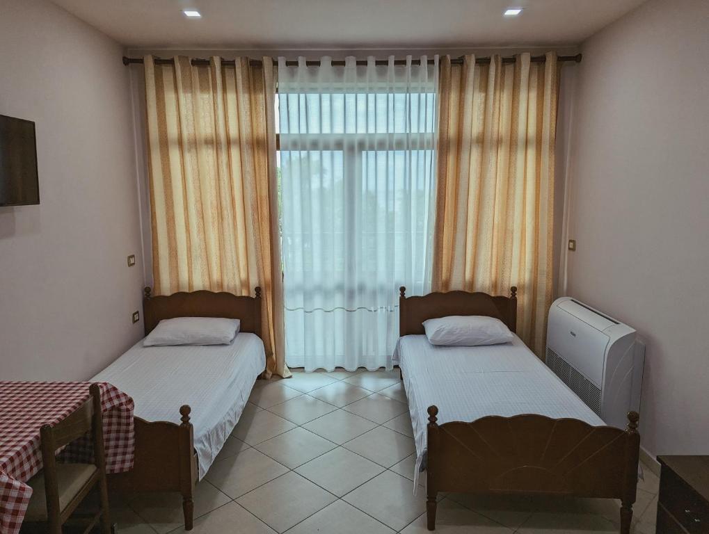 Postel nebo postele na pokoji v ubytování Vila Vadeha