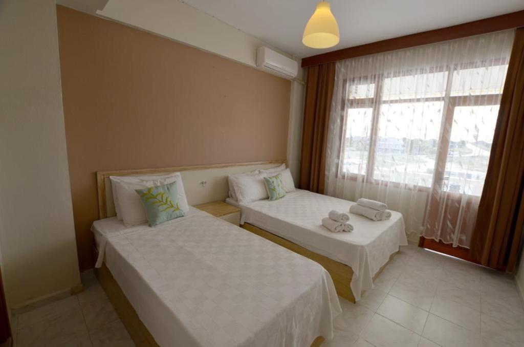 Postel nebo postele na pokoji v ubytování ŞEREF APART MOTEL