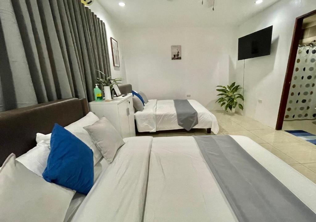 Postel nebo postele na pokoji v ubytování Cheryl's Place Vacation Home Palawan