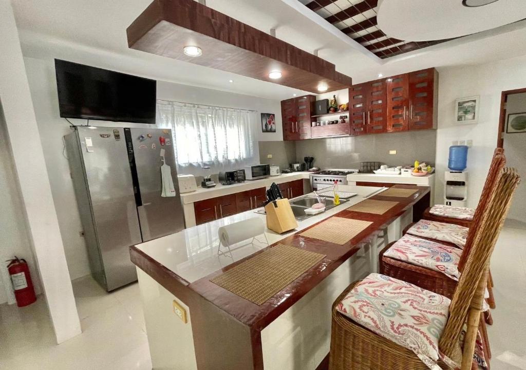 Kuchyň nebo kuchyňský kout v ubytování Cheryl's Place Vacation Home Palawan