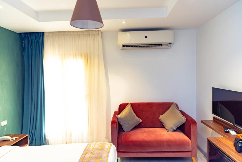 TV a/nebo společenská místnost v ubytování Jasmine Pyramids Hotel