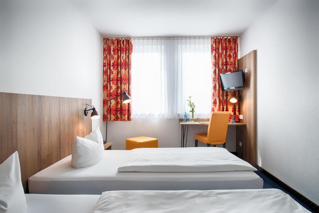 Postel nebo postele na pokoji v ubytování ACHAT Hotel Dresden Altstadt