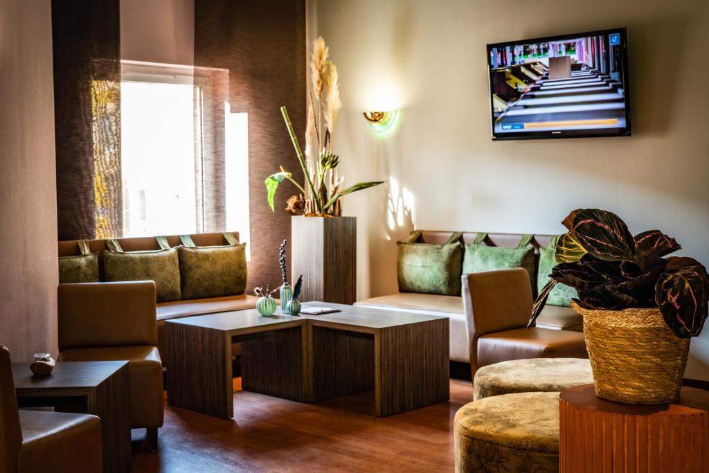 TV a/nebo společenská místnost v ubytování ACHAT Hotel Dresden Altstadt