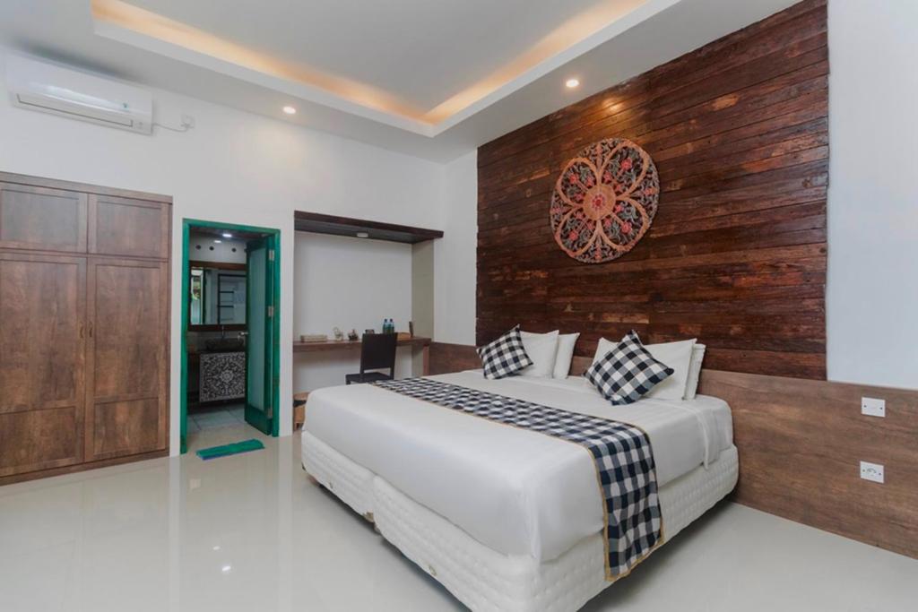 Postel nebo postele na pokoji v ubytování Nawa Sakti Ubud Suite