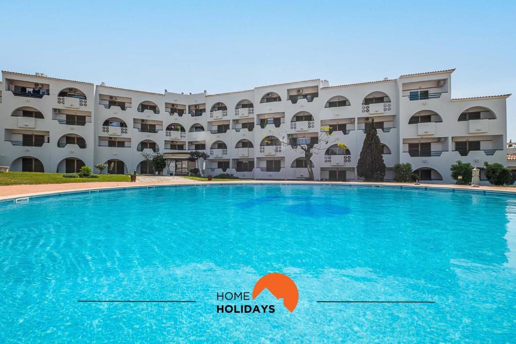 a large swimming pool in front of a large building at #081 T1 Vale Mangude 312 by Home Holidays in Vale de Pedras