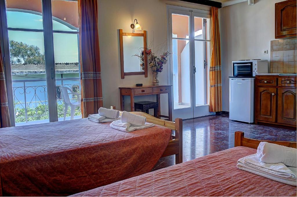 Cama o camas de una habitación en Hotel Benitses Arches