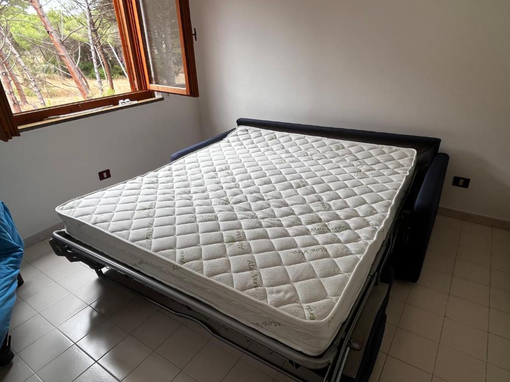 Un pat sau paturi într-o cameră la Arboria Sun & Sea