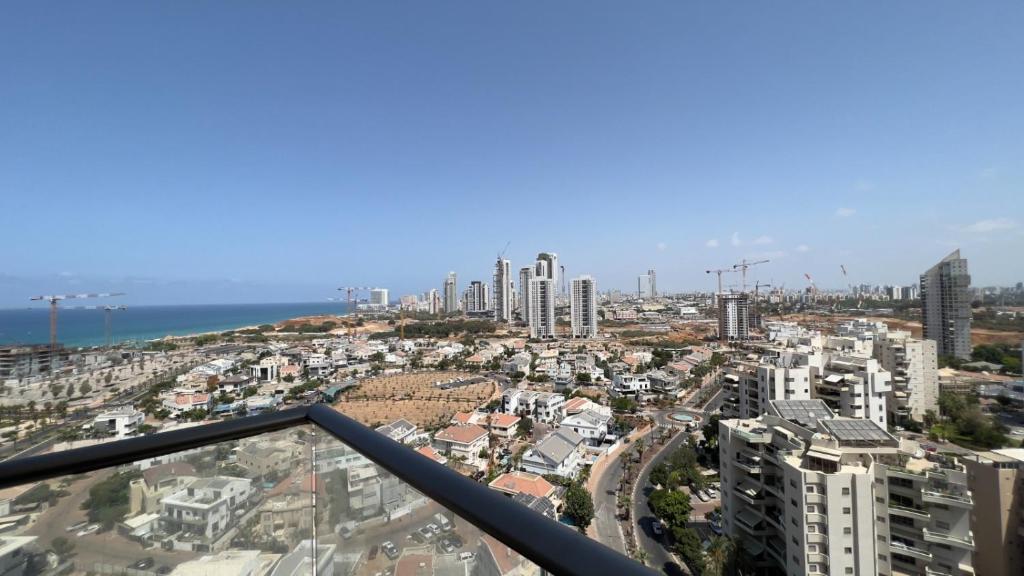 a view of a city from the top of a building at Roy Vacation Home in Rishon LeẔiyyon