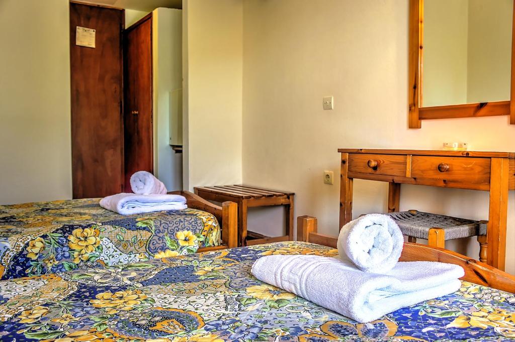 Cama o camas de una habitación en Hotel Benitses Arches