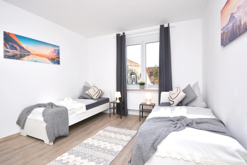 Postel nebo postele na pokoji v ubytování NUE08-RI Apartment in Zirndorf