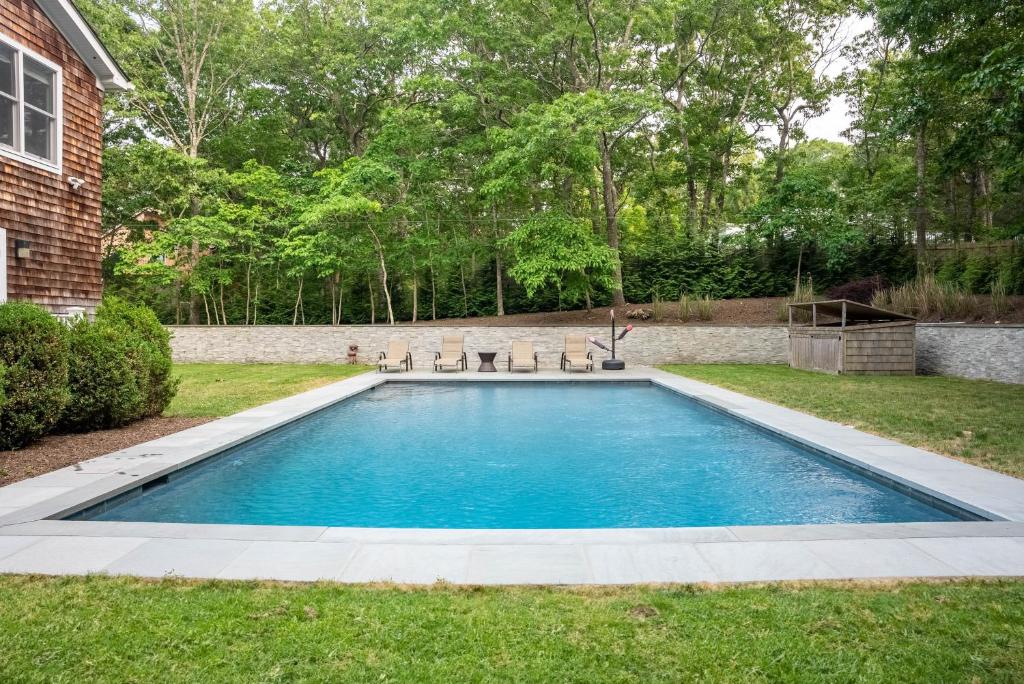 a swimming pool in the yard of a house at 28 Ocean Pkwy, East Hampton NY 11937 in East Hampton