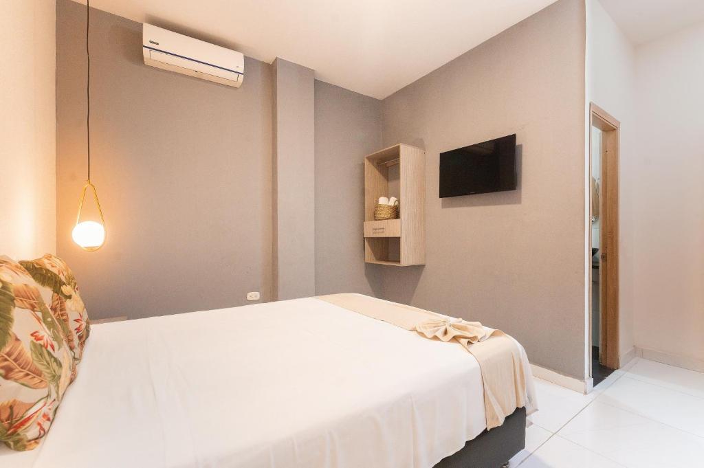 Postel nebo postele na pokoji v ubytování Hotel París