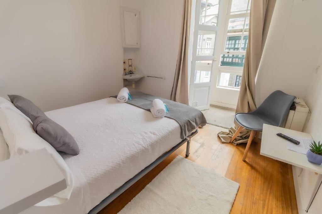 Posteľ alebo postele v izbe v ubytovaní Hostal San Pelayo
