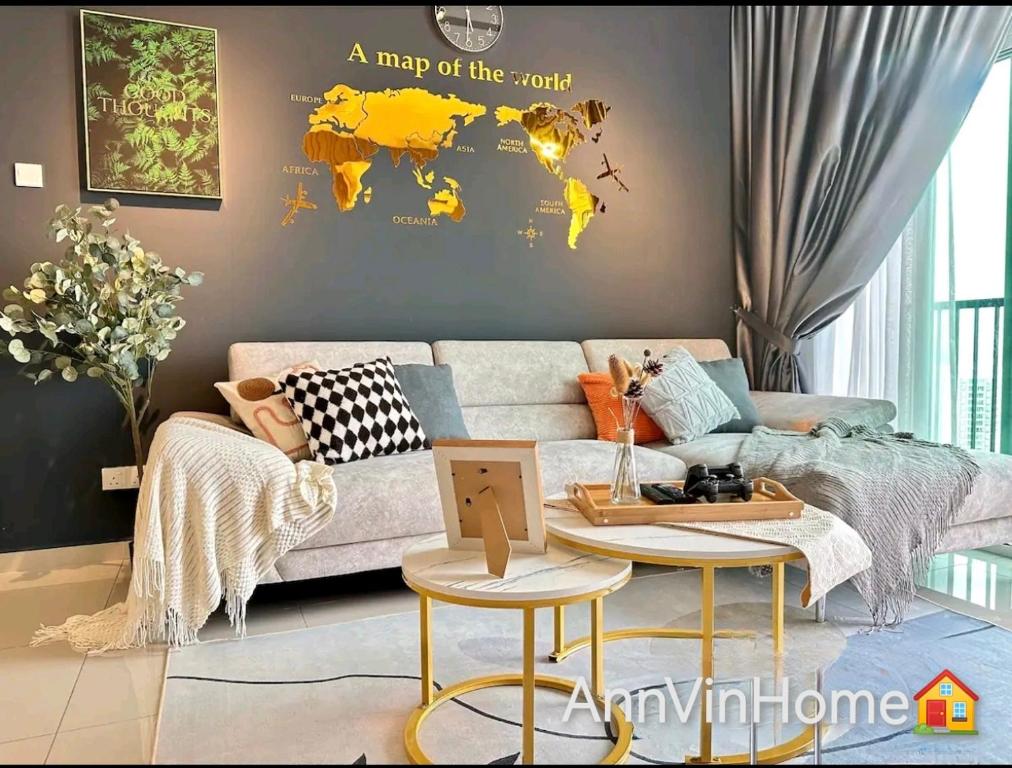 a living room with a couch and a map of the world at Novo 8 2-Bedrooms Condo Extreme City View Suite in Malacca