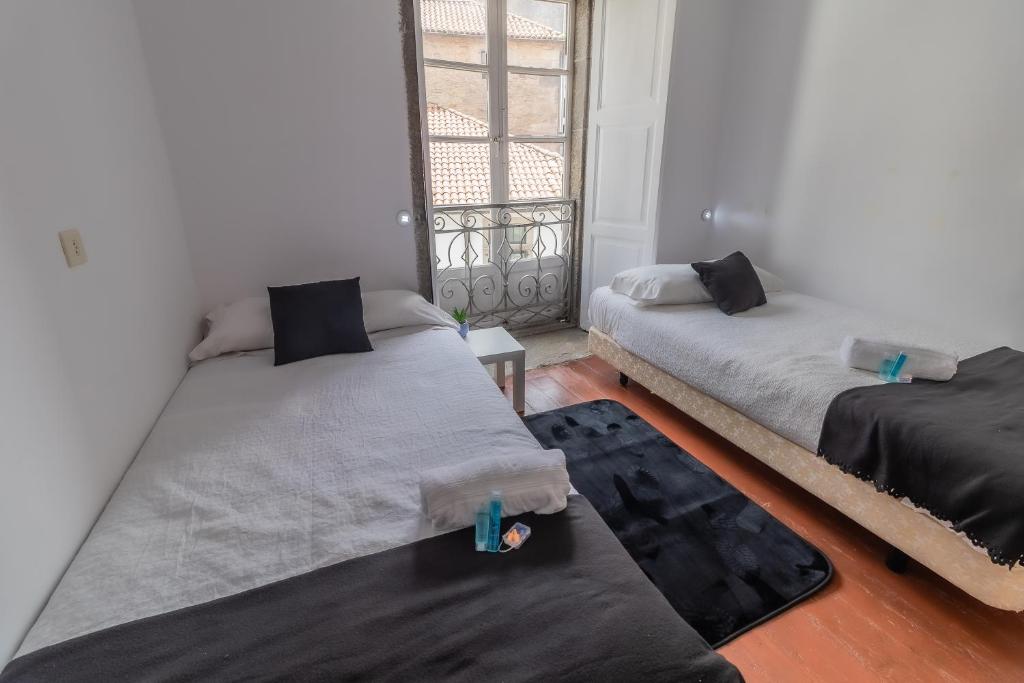 Posteľ alebo postele v izbe v ubytovaní Hostal San Pelayo