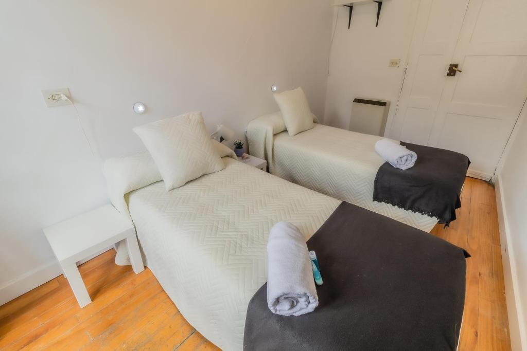 Posteľ alebo postele v izbe v ubytovaní Hostal San Pelayo