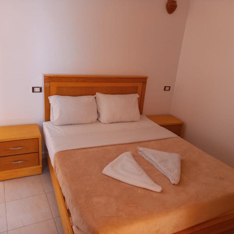 A bed or beds in a room at Nile Sunrise Flats