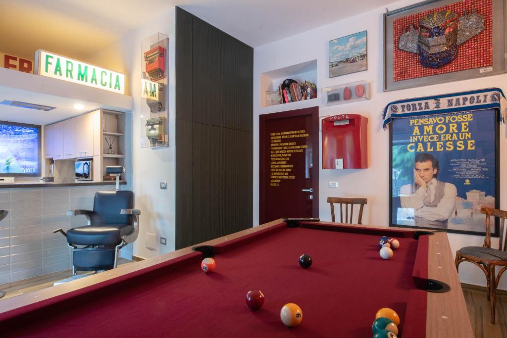 a bar with a pool table in a room at B.BUNKER in San Nicola La Strada