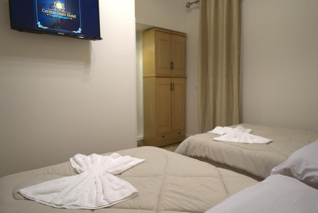 Postel nebo postele na pokoji v ubytování Central Cairo Hotel