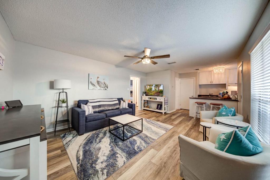 a living room with a couch and a table at Sea Horse 112 by Vacation Homes Collection in Gulf Shores