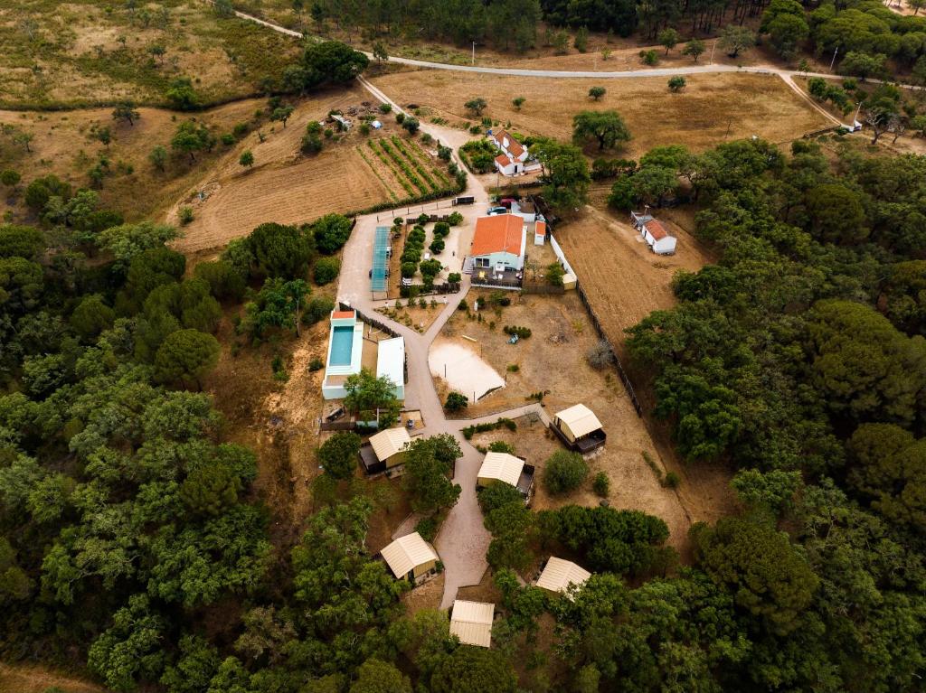 an aerial view of a farm with a house at Cabanas de Melides in Melides