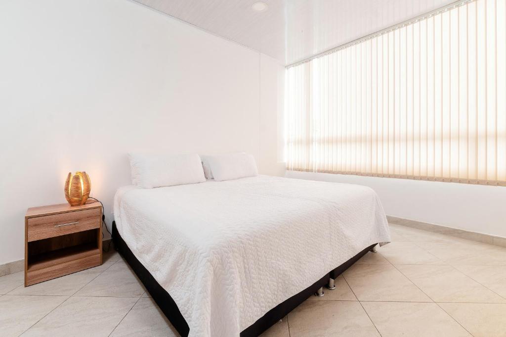Postel nebo postele na pokoji v ubytování Hotel París