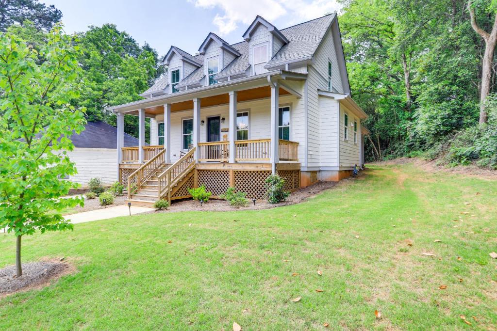 a house with a large yard in front of it at Quaint Newnan Vacation Rental Near State Park! in Newnan