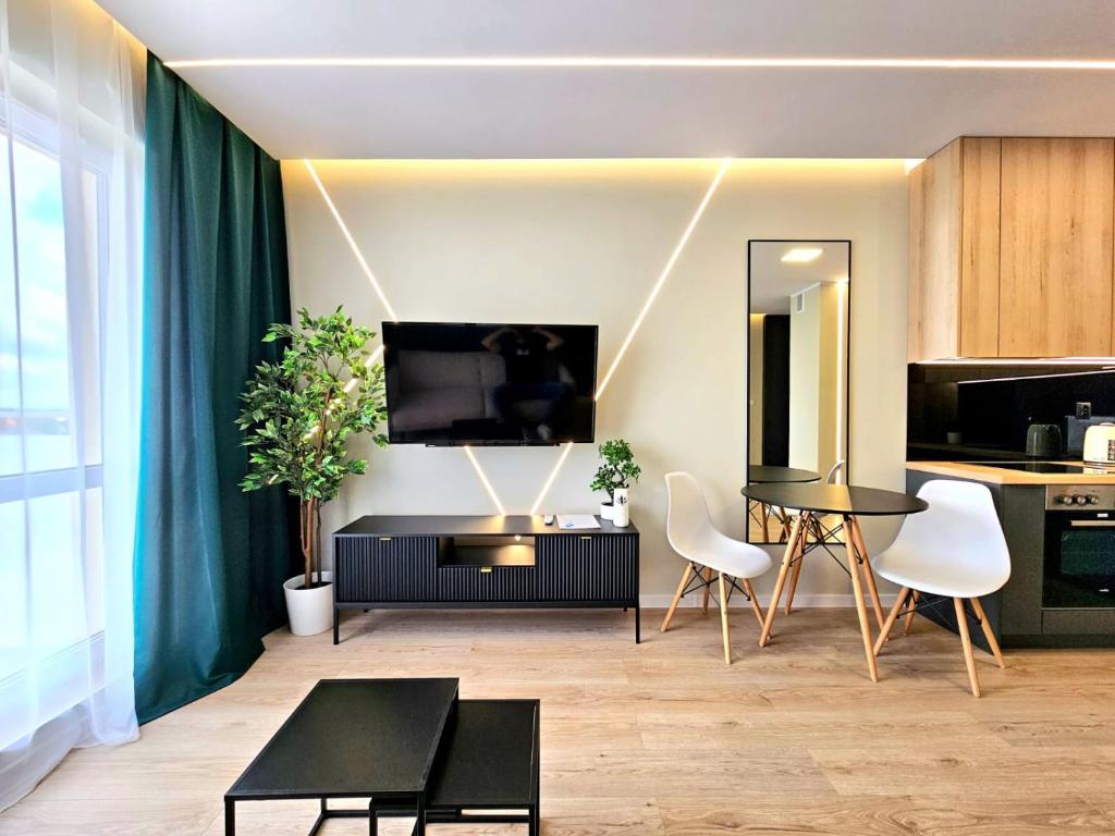 TV a/nebo společenská místnost v ubytování Nowy Apartament 53 z klimatyzacją