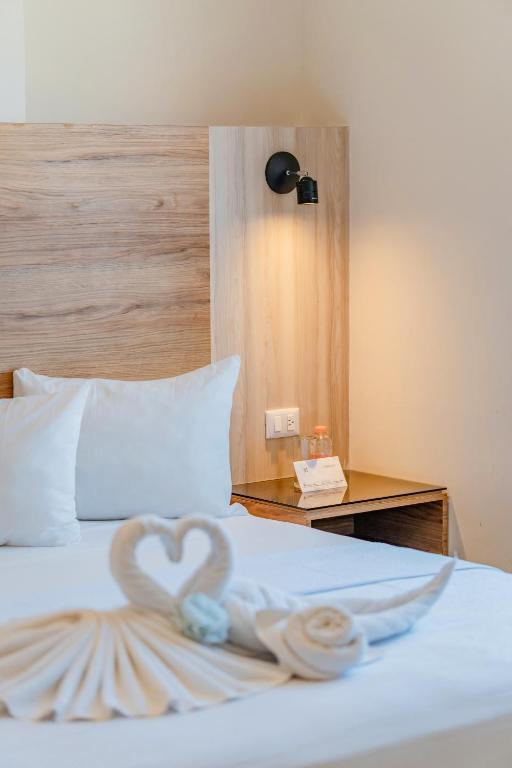 Postel nebo postele na pokoji v ubytování Hotel Central Merida by Kavia